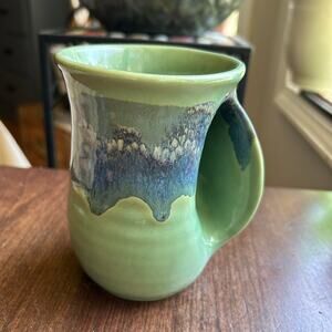 Clay in motion hand warmer mug signed